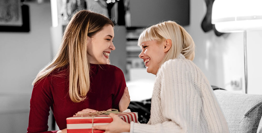 Christian women giving a gift to her friend