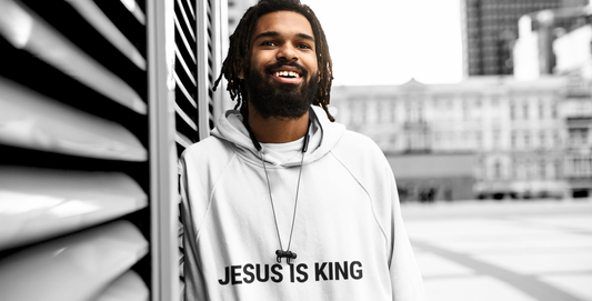 Male model in white Gracegiber Jesus is king hoodie