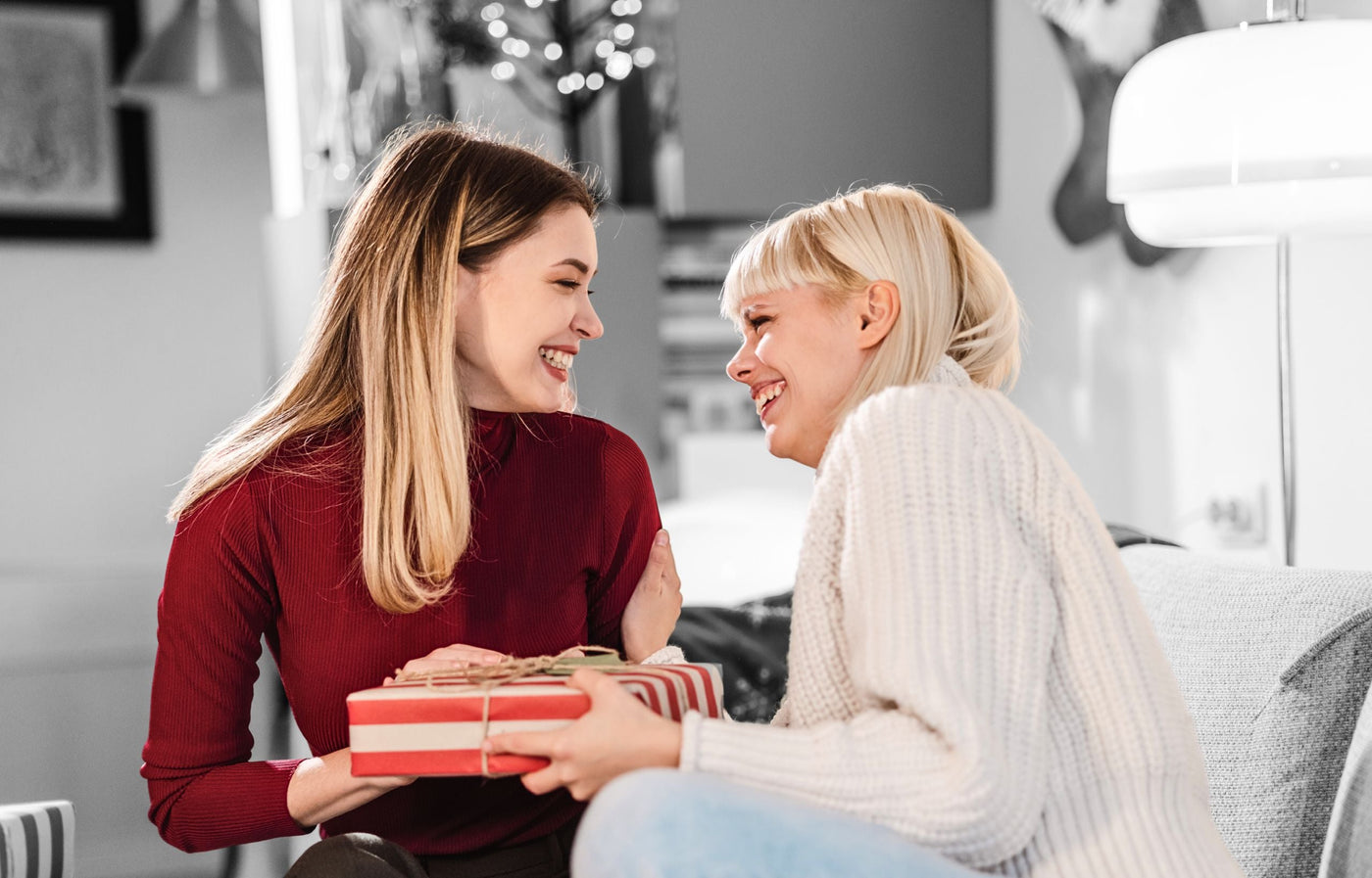 Christian women giving a gift to her friend
