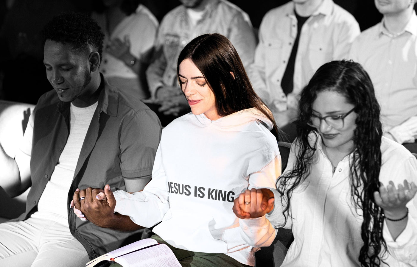 Christians holding hands and praying