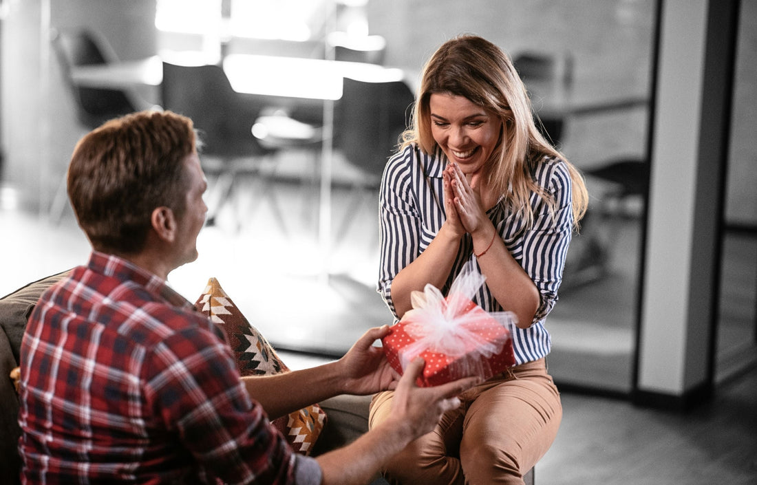 Man gifting his wife a Christian gift