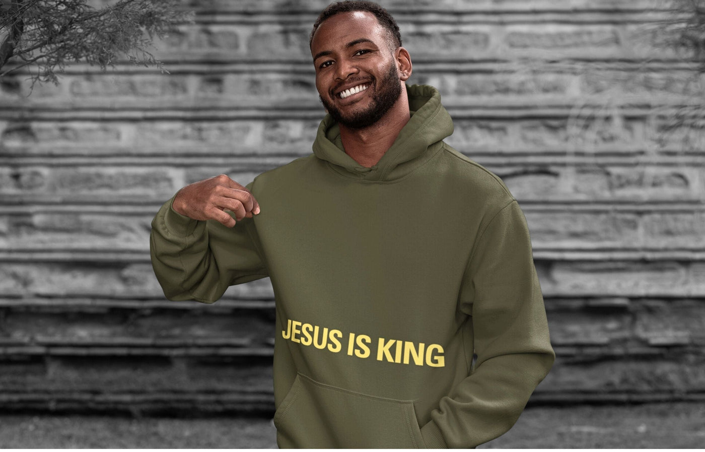 Man wearing a green Jesus pullover hoodie