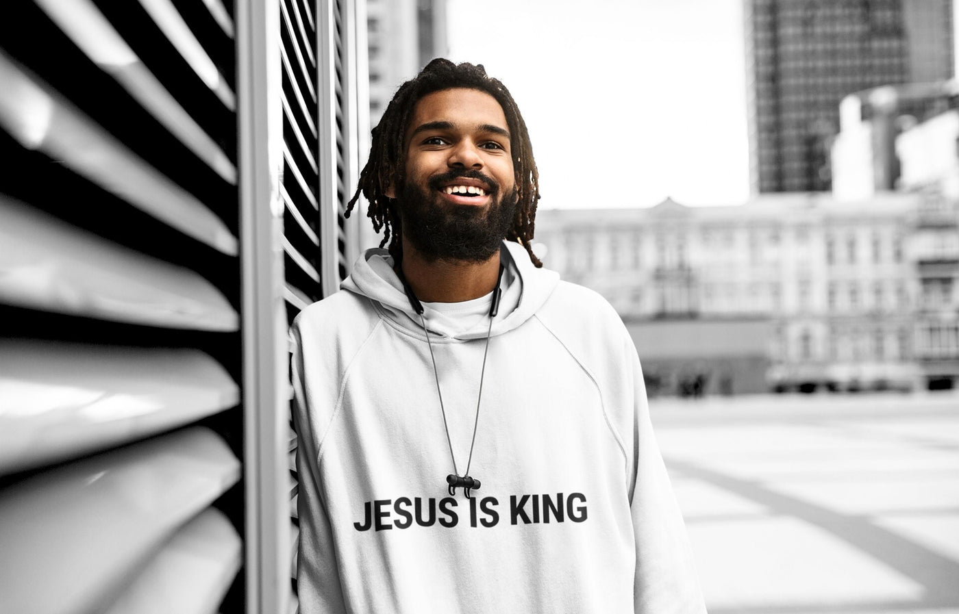 Male model in white Gracegiber Jesus is king hoodie