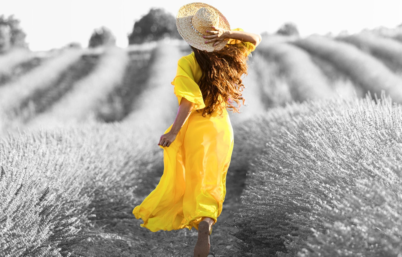Girl walking alone in a field