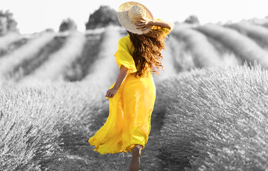 Girl walking alone in a field